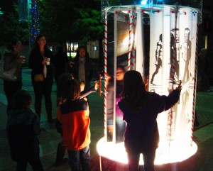 Kids interacting with art on Flora St.